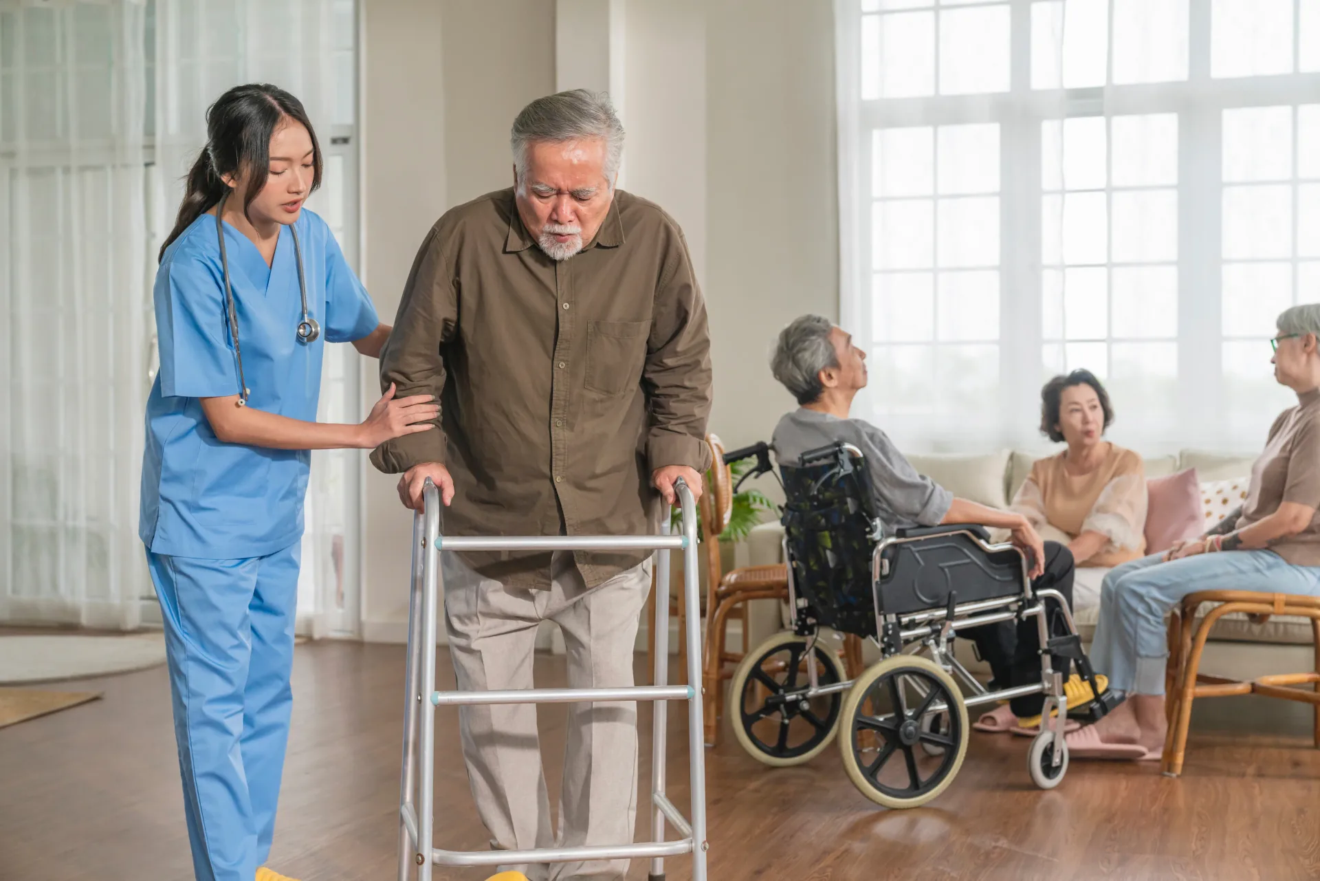 Care worker supporting an older person with walking mobility