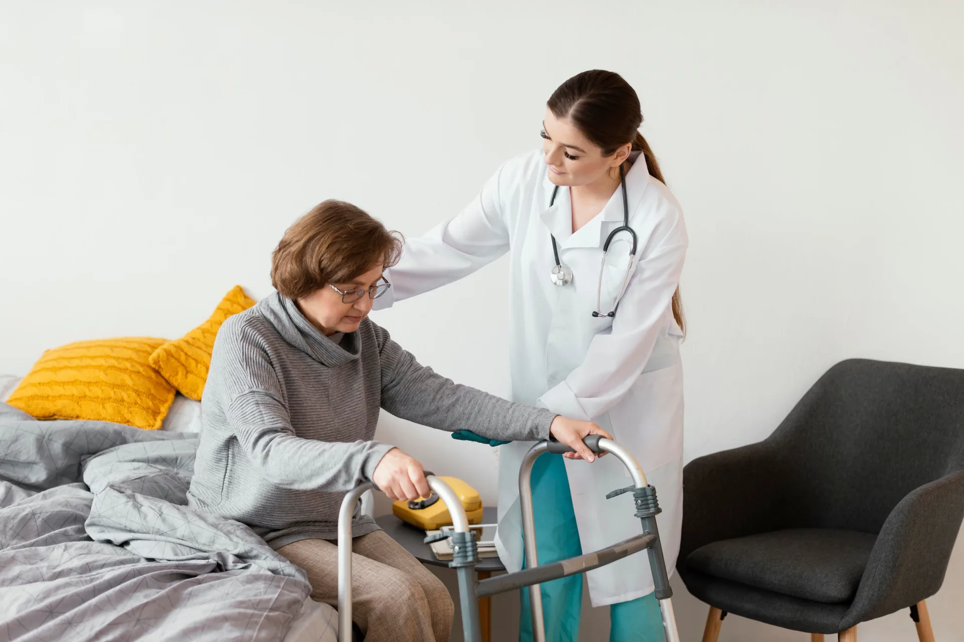 Care worker assisting an older person with mobility