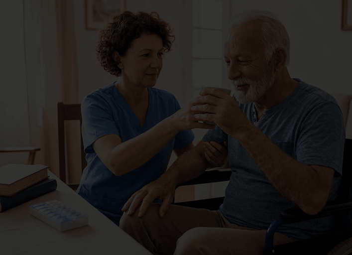 Care worker supporting an older person at home