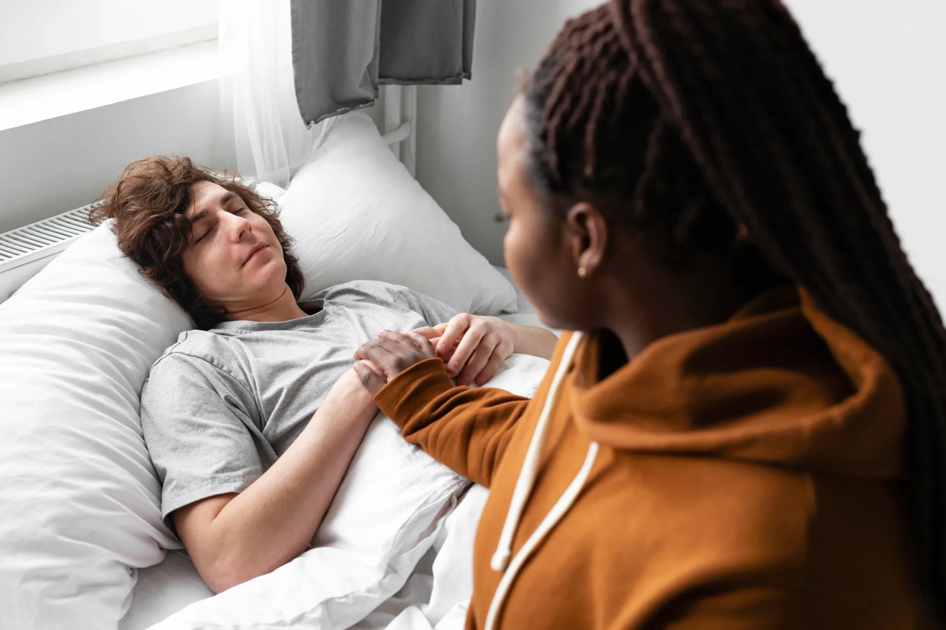 Care worker supporting a person with spinal cord injury